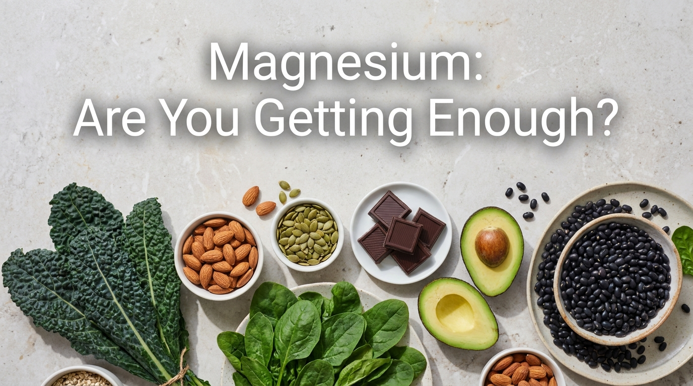 Magnesium-rich foods including leafy greens, almonds, pumpkin seeds, dark chocolate and avocado arranged on a stone surface